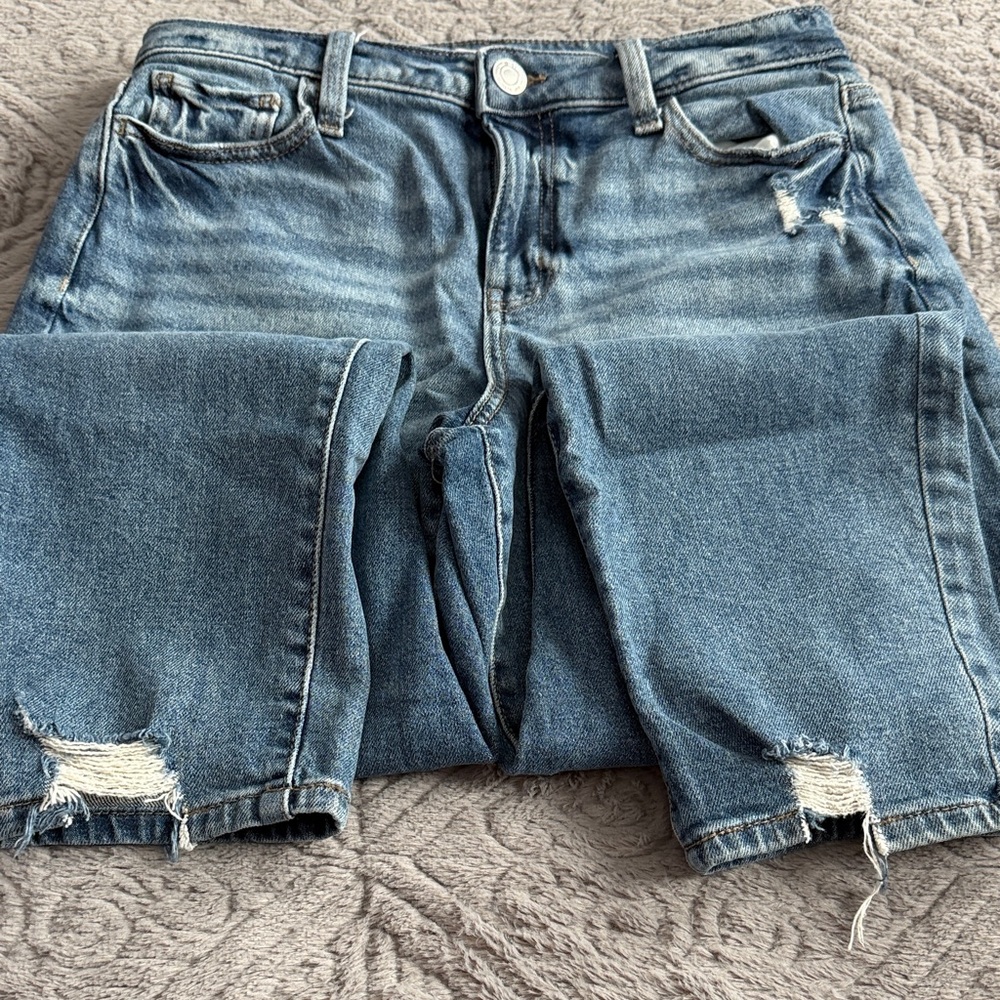 SO Women's Boot Cut Jeans in Faded Blue with Distressed Hem